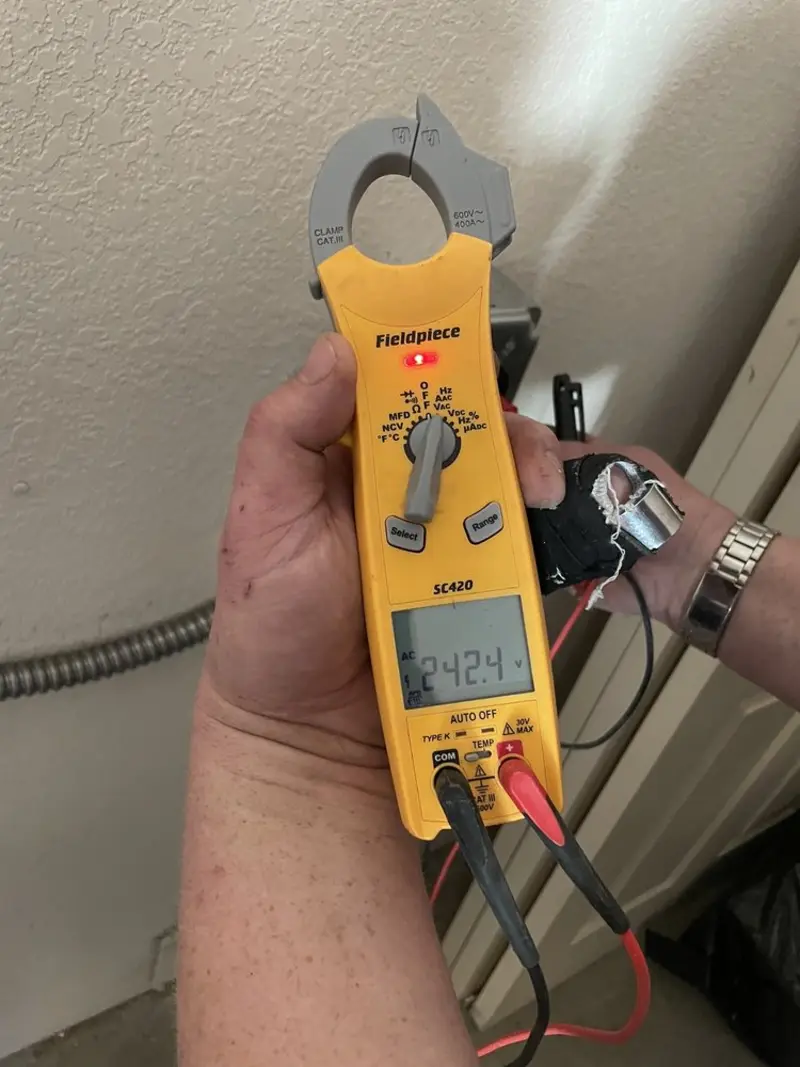 Voltage testing with clamp meter during Electrical Installation Services in Elko New Market